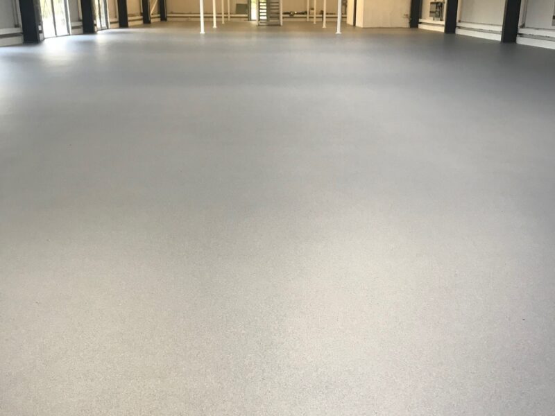 Inside of a large warehouse with flake flooring