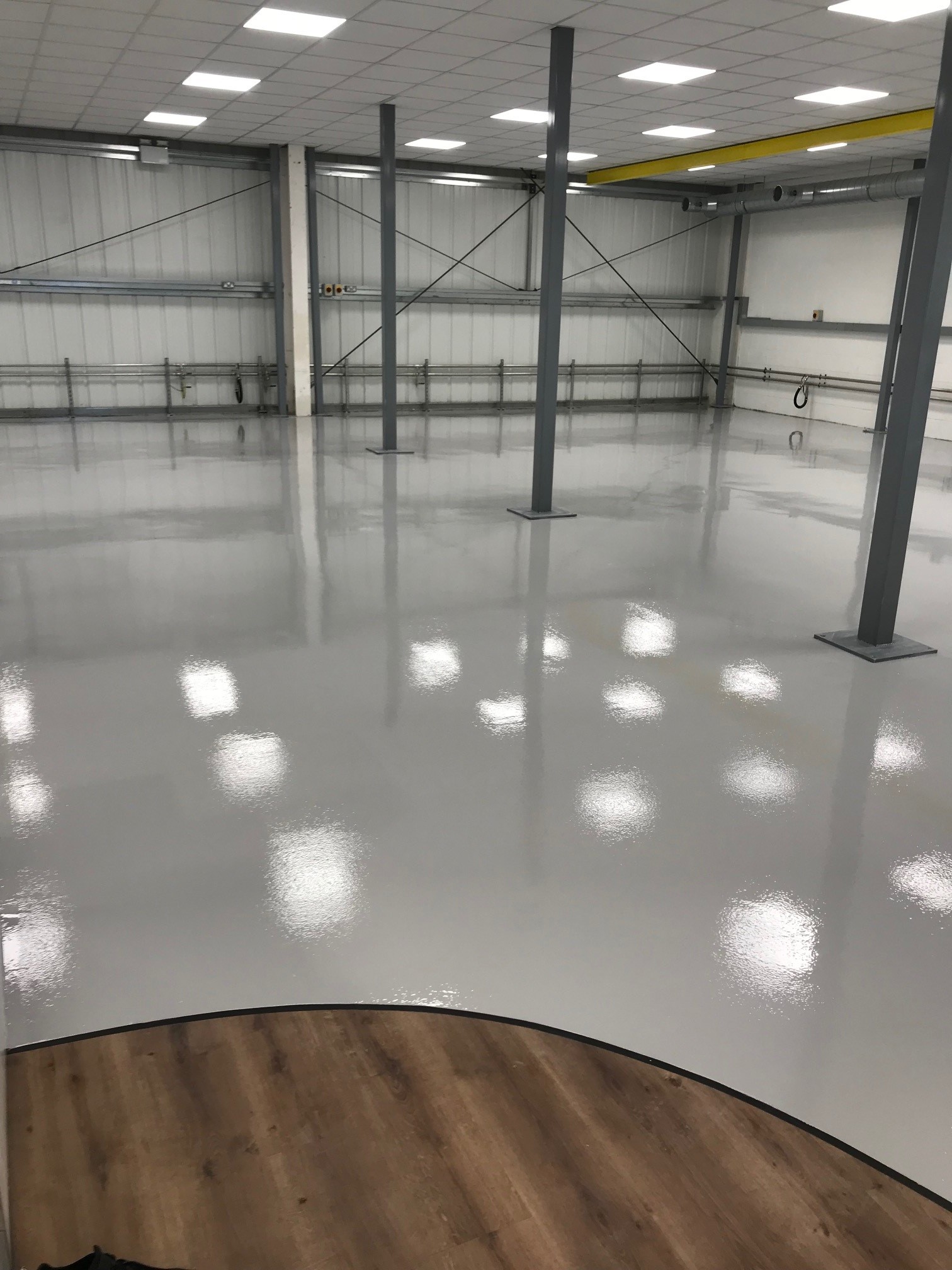 Epoxy resin flooring in empty warehouse